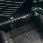 Close-up of Trask carbon fiber shift linkage for Harley-Davidson motorcycles.