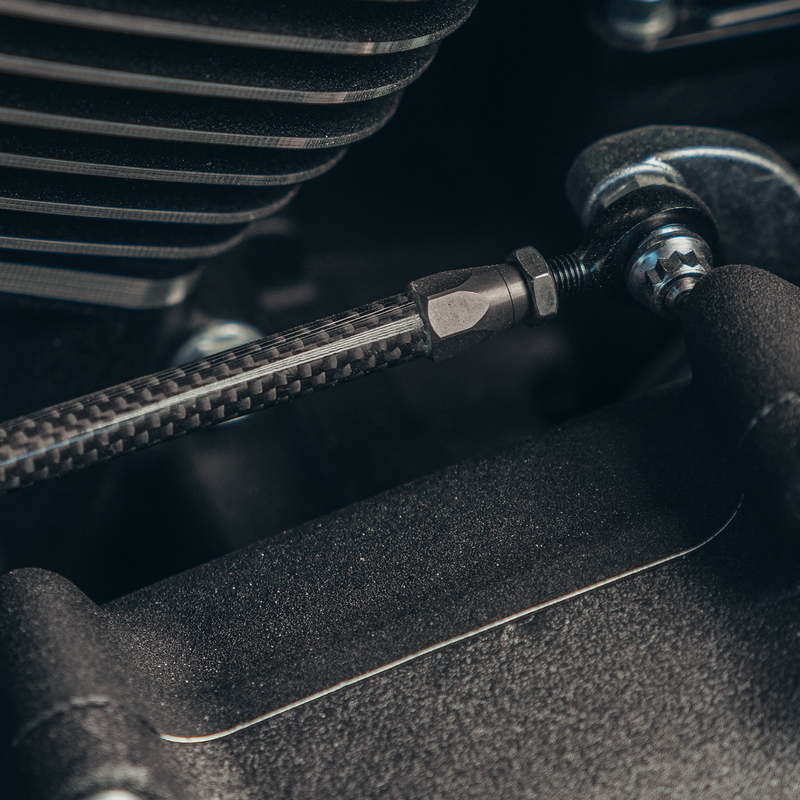 Close-up of Trask carbon fiber shift linkage for Harley-Davidson motorcycles.