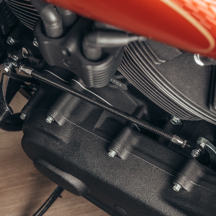Close-up of Trask carbon fiber shift linkage for Harley-Davidson baggers.