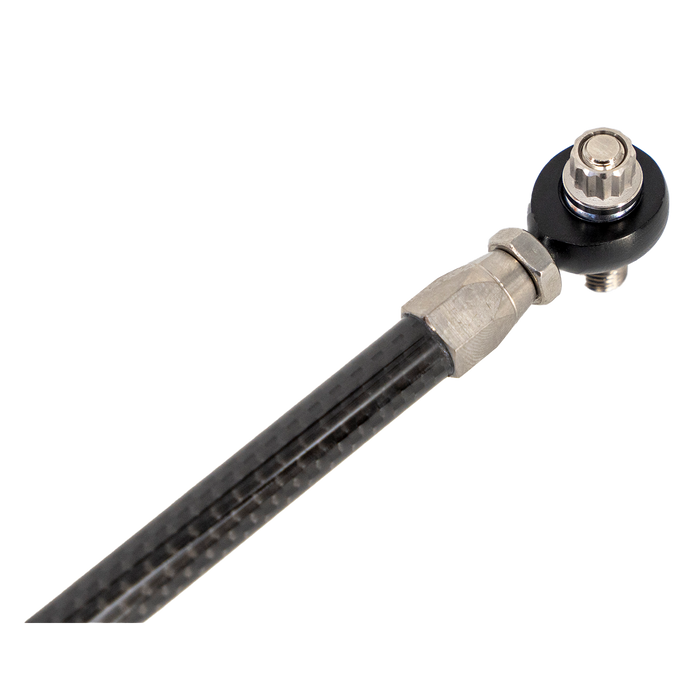 Close-up of Trask carbon fiber shift linkage with heim joint for precise shifting.