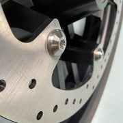 Close up from the brake rotor and the chrome bolts